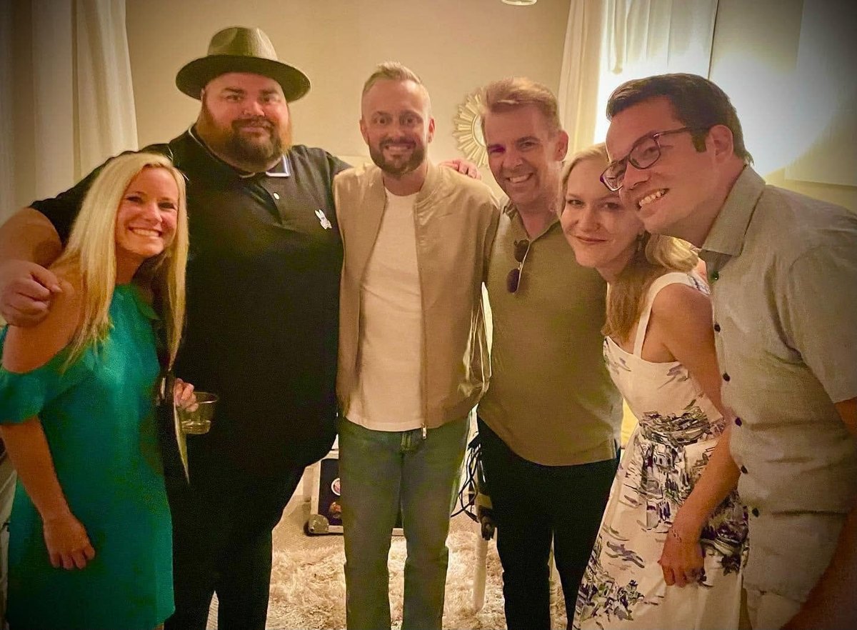 Nathan Adam with comedian Nate Bargatze and four friends at an evening event