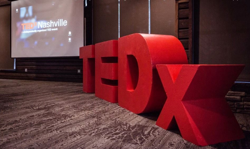 The red TEDx letters on the TEDxNashville stage