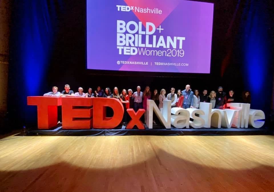 The TEDxNashville team lined up behind the giant TEDxNashville letters on stage at Bold and Brilliant, TEDWomen 2019