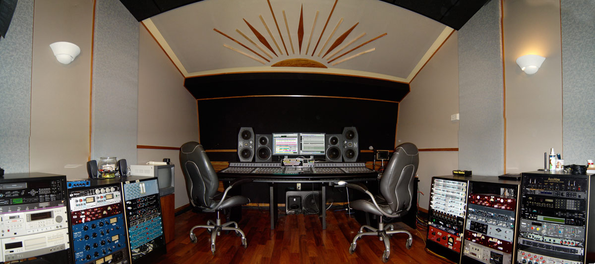 The control room at The Walnut House, a mixing desk and monitors facing the live room